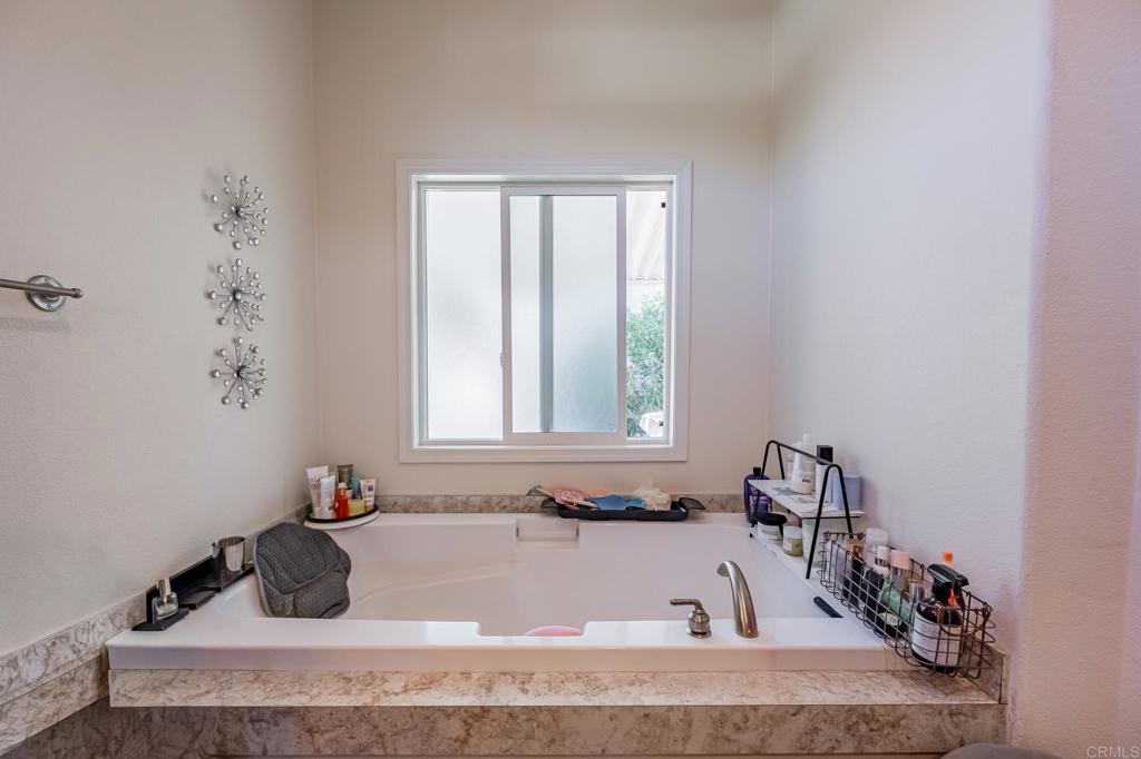4650 Dulin Road, Unit 126 Fallbrook, CA 92003 - Photo 15 of 41 a bathroom with a tub sink and window