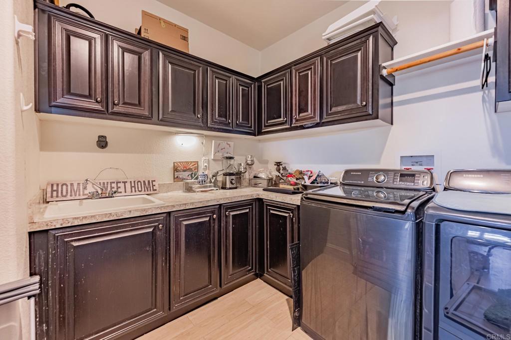 4650 Dulin Road, Unit 126 Fallbrook, CA 92003 - Photo 19 of 41 a kitchen with stainless steel appliances granite countertop a sink stove and cabinets