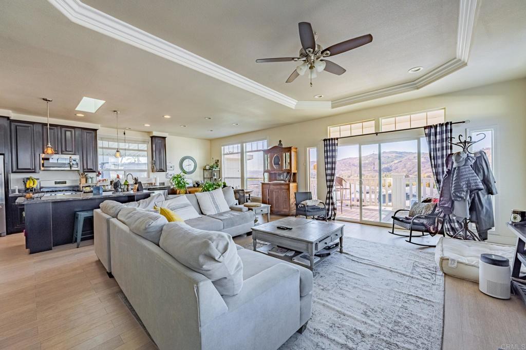 4650 Dulin Road, Unit 126 Fallbrook, CA 92003 - Photo 3 of 41 a living room with furniture kitchen area and large windows