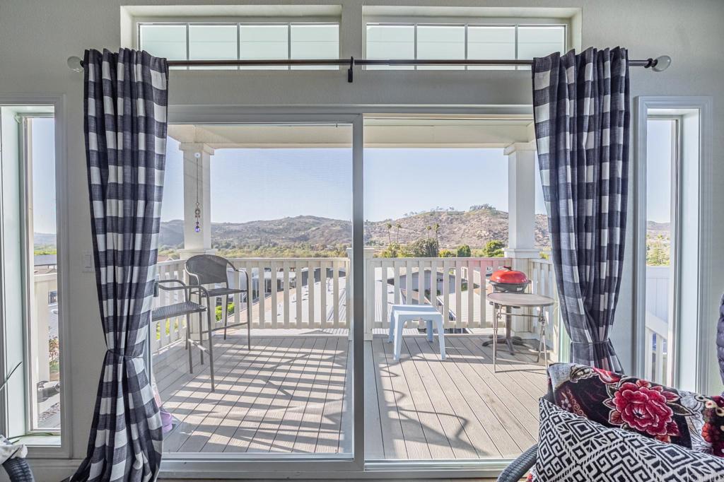 4650 Dulin Road, Unit 126 Fallbrook, CA 92003 - Photo 4 of 41 a view of a balcony and a floor to ceiling window