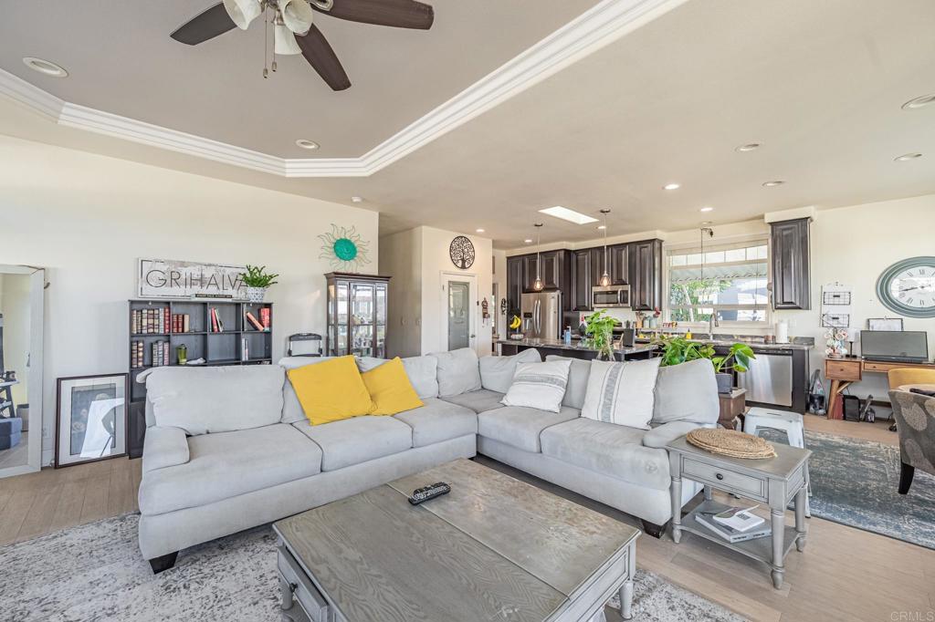 4650 Dulin Road, Unit 126 Fallbrook, CA 92003 - Photo 5 of 41 a living room with furniture kitchen view and a flat screen tv
