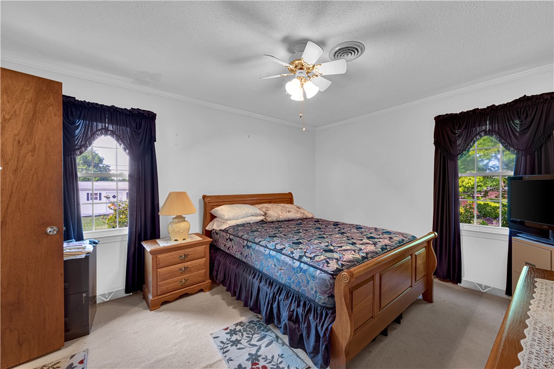 307 Calhoun Road Belton, SC 29627 - Photo 22 of 30 A well-lit bedroom offering a cozy retreat with ample natural light.