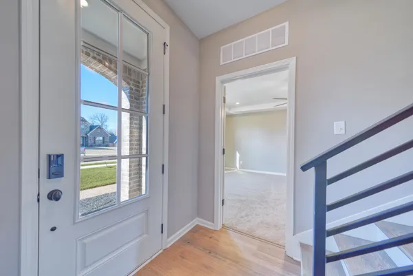 a bathroom with a granite countertop sink a mirror and shower