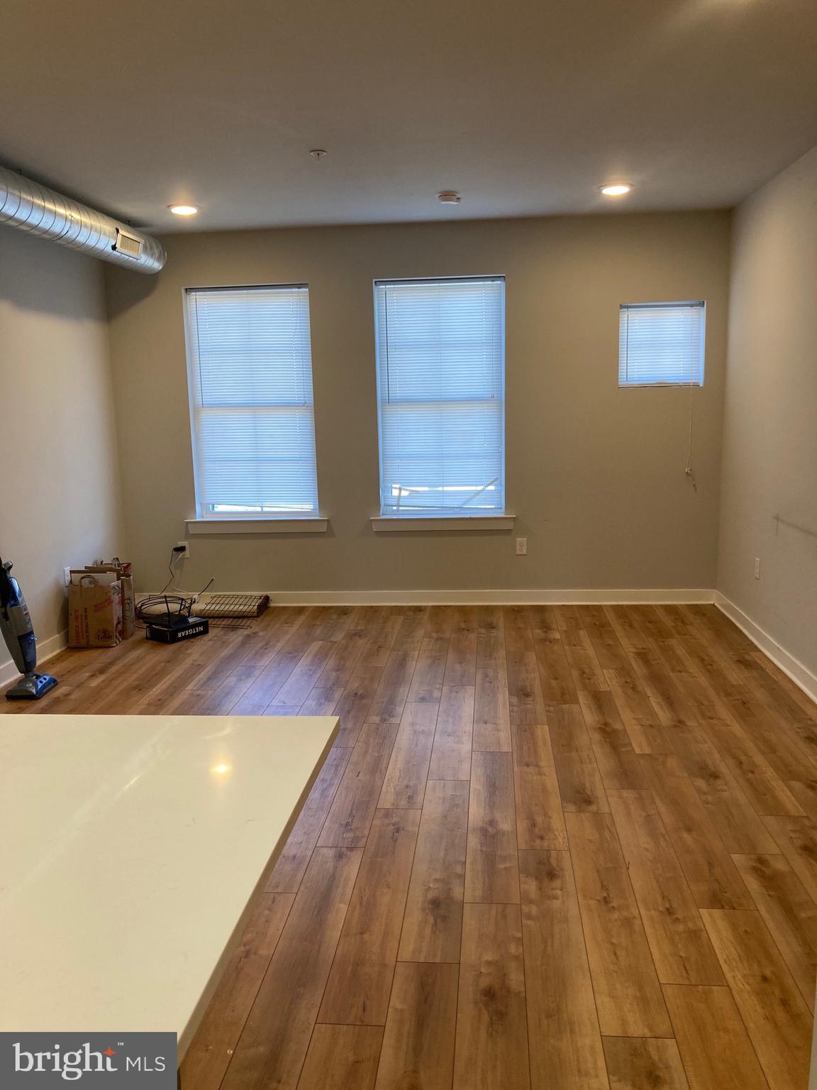 2553 North Front Street, Unit 3 Philadelphia, PA 19133 - Photo 5 of 16 a view of a room with wooden floor and window