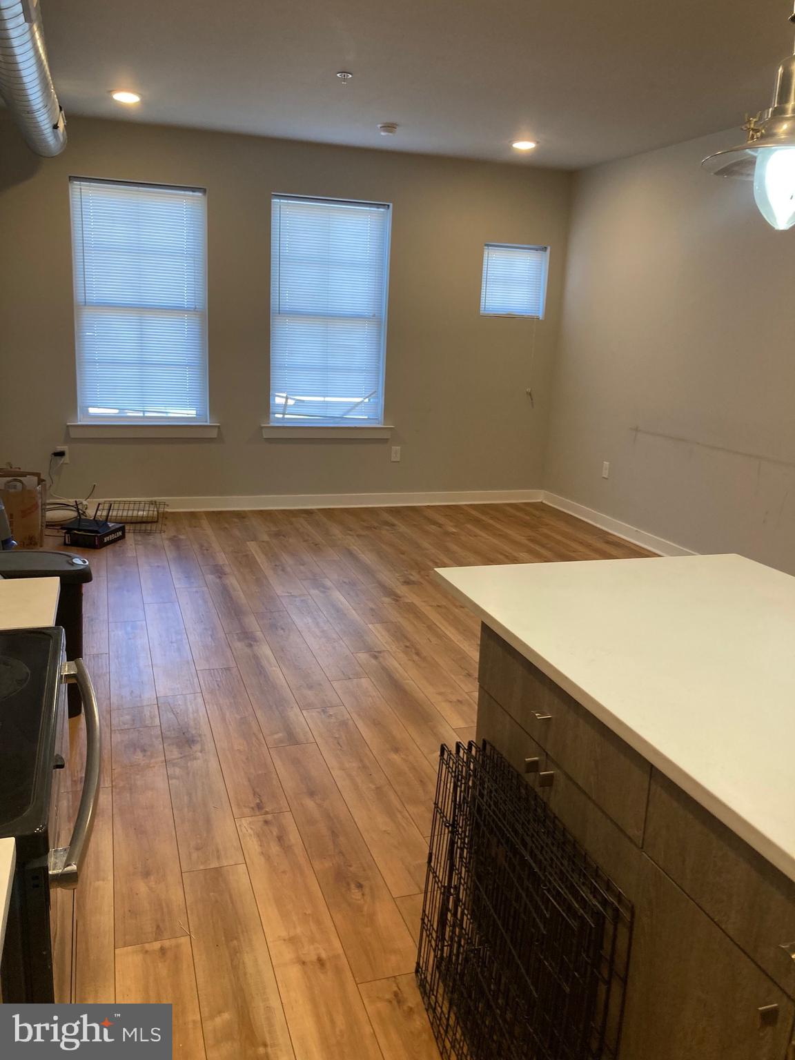 2553 North Front Street, Unit 3 Philadelphia, PA 19133 - Photo 6 of 16 a view of an empty room with wooden floor and a window