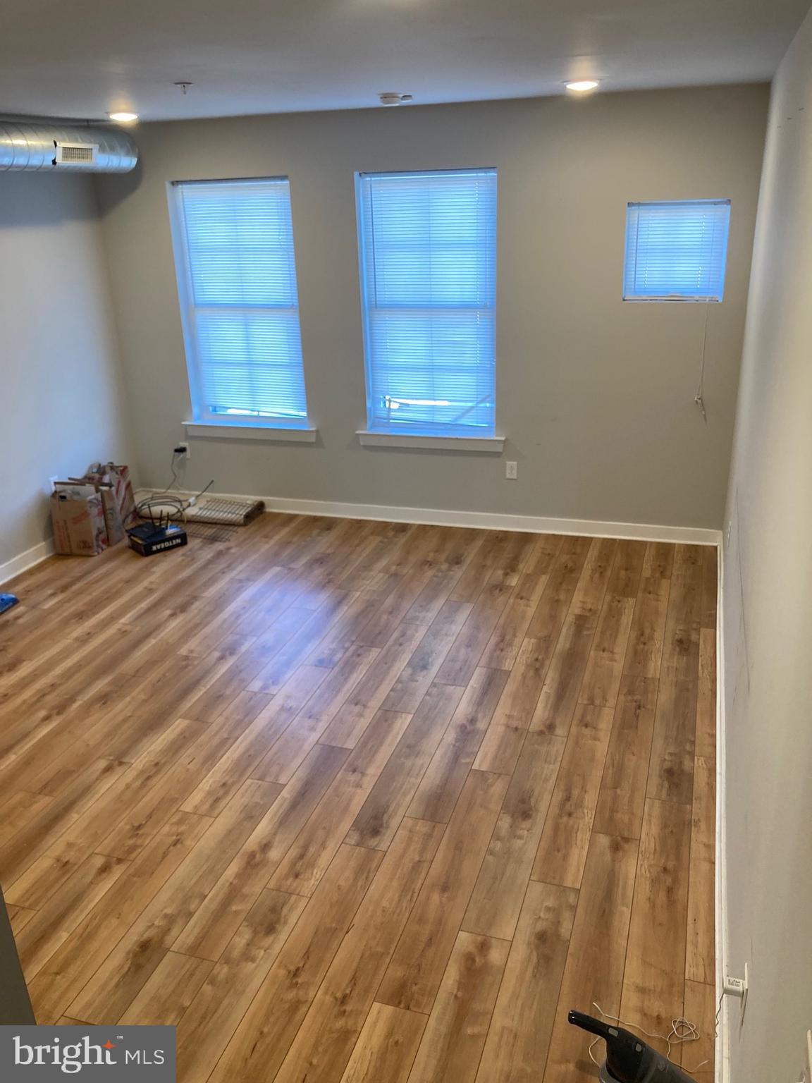 2553 North Front Street, Unit 3 Philadelphia, PA 19133 - Photo 7 of 16 a view of a room with wooden floor and windows