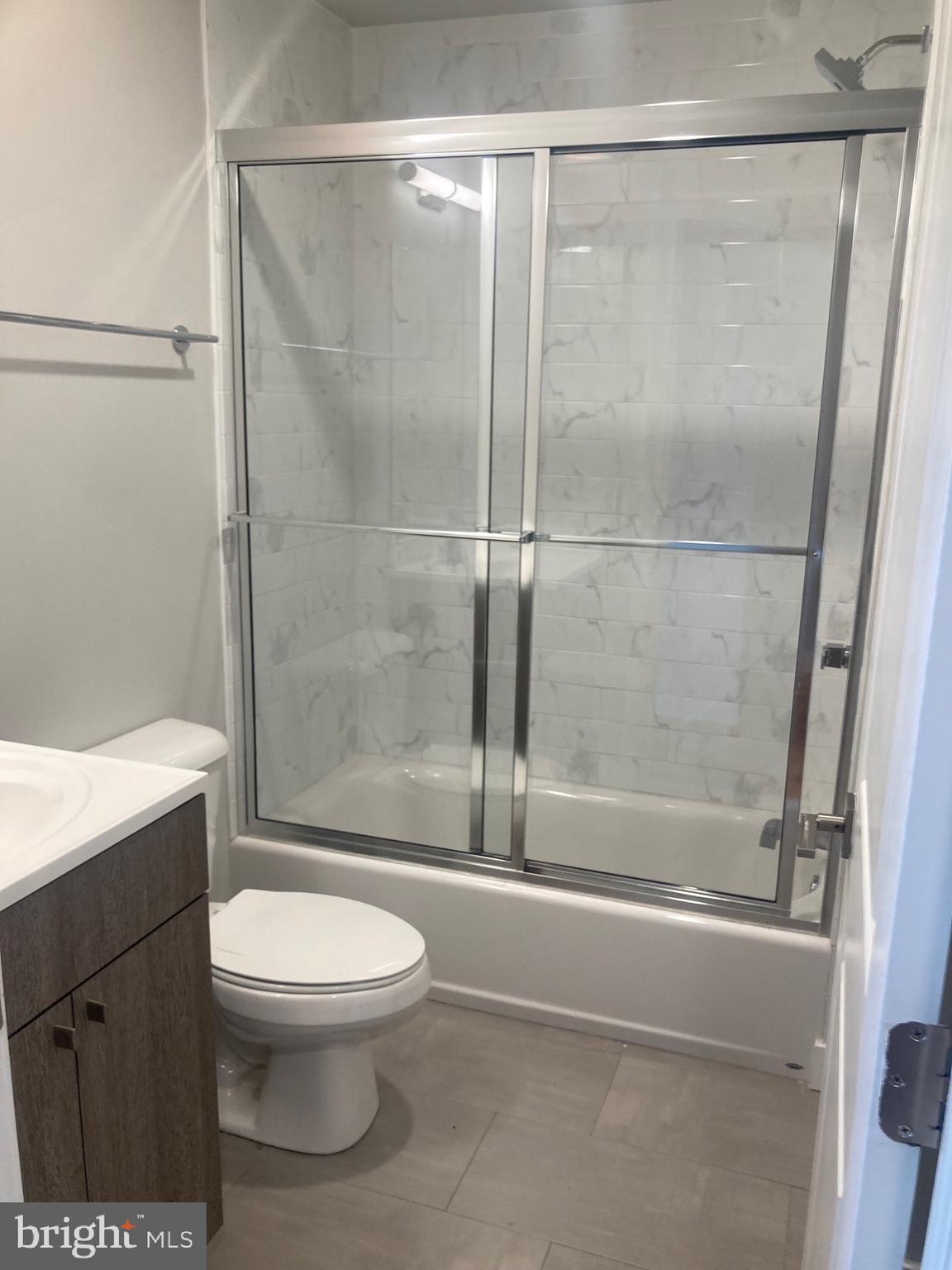 2553 North Front Street, Unit 3 Philadelphia, PA 19133 - Photo 8 of 16 a bathroom with a toilet and a shower