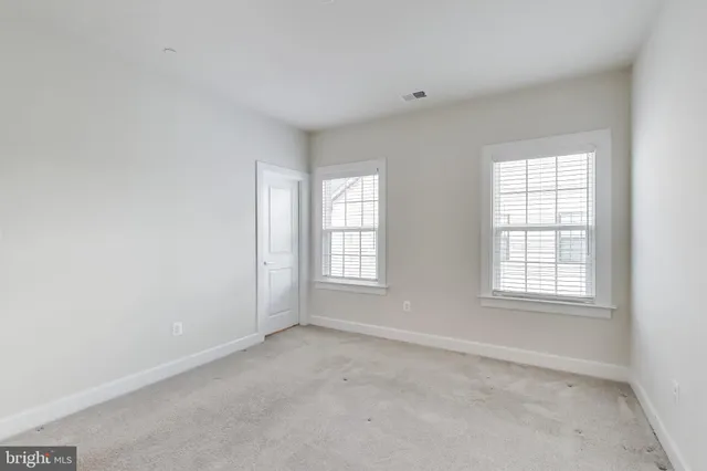 a bathroom with a granite countertop tub sink and mirror