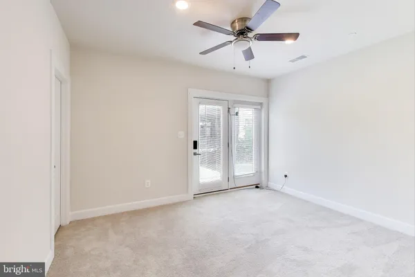 a utility room with washing machine