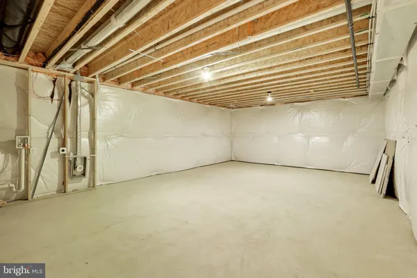 a view of a house with a big yard and large trees