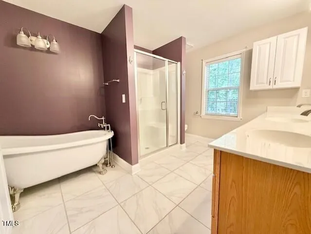 en empty room with windows and a ceiling fan