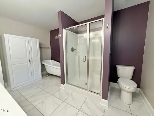 a bathroom with a sink a toilet and bathtub