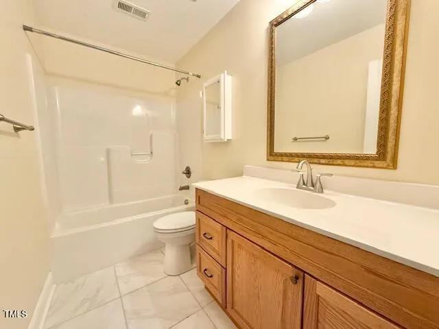 a spacious bathroom with a mirror sink and a mirror