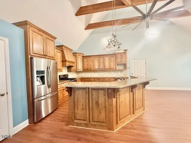 a view of a kitchen with a wooden floor