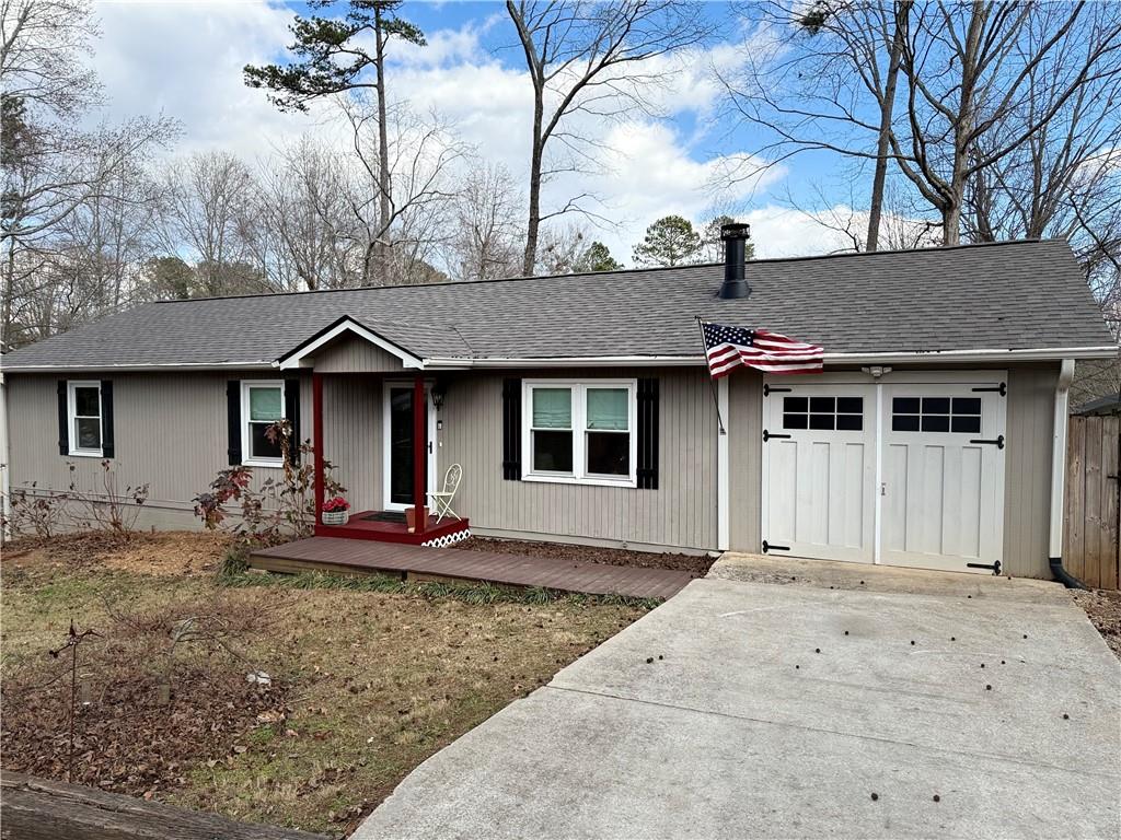 2655 Pilgrim Mill Road Cumming, GA 30041 - Photo 1 of 1 a front view of a house with garden