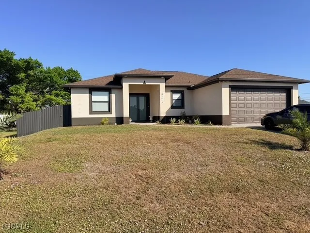 a front view of a house with a yard