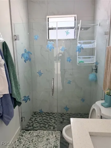 a bathroom with a sink and toilet