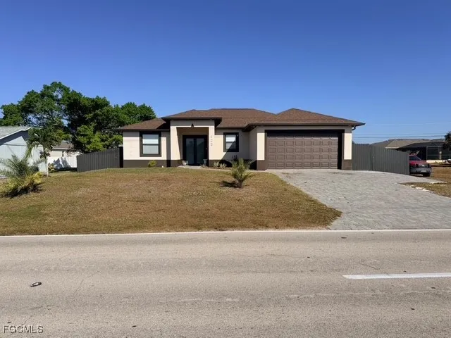 a front view of a house with a yard