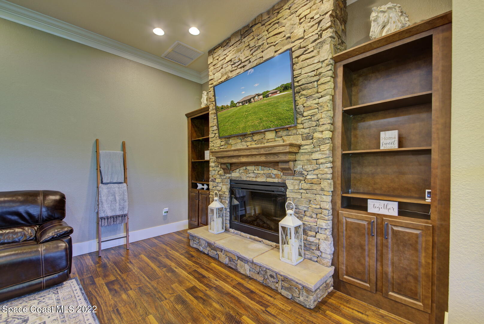 3500 Aurantia Road Mims, FL 32754 - Photo 28 of 55 Built-in Bookcases & Stone Fireplace