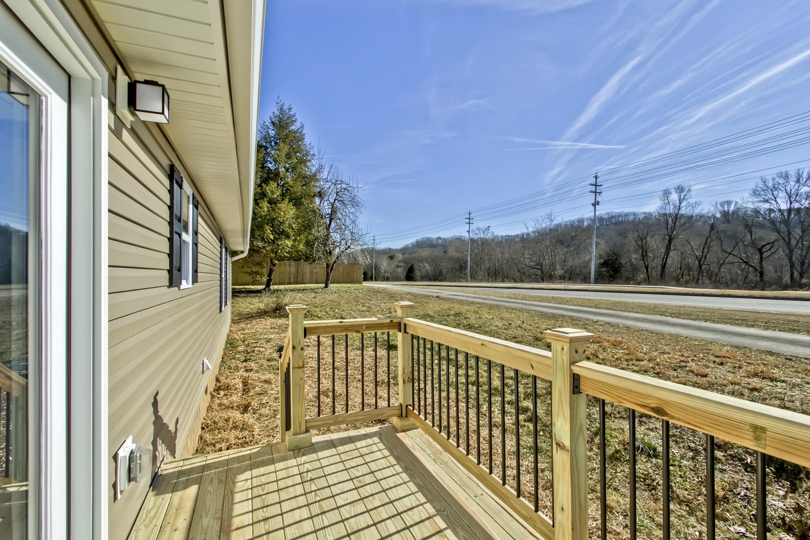 223 Butler Road Oak Ridge, TN 37830 - Photo 12 of 27 a view of balcony with wooden floor and fence