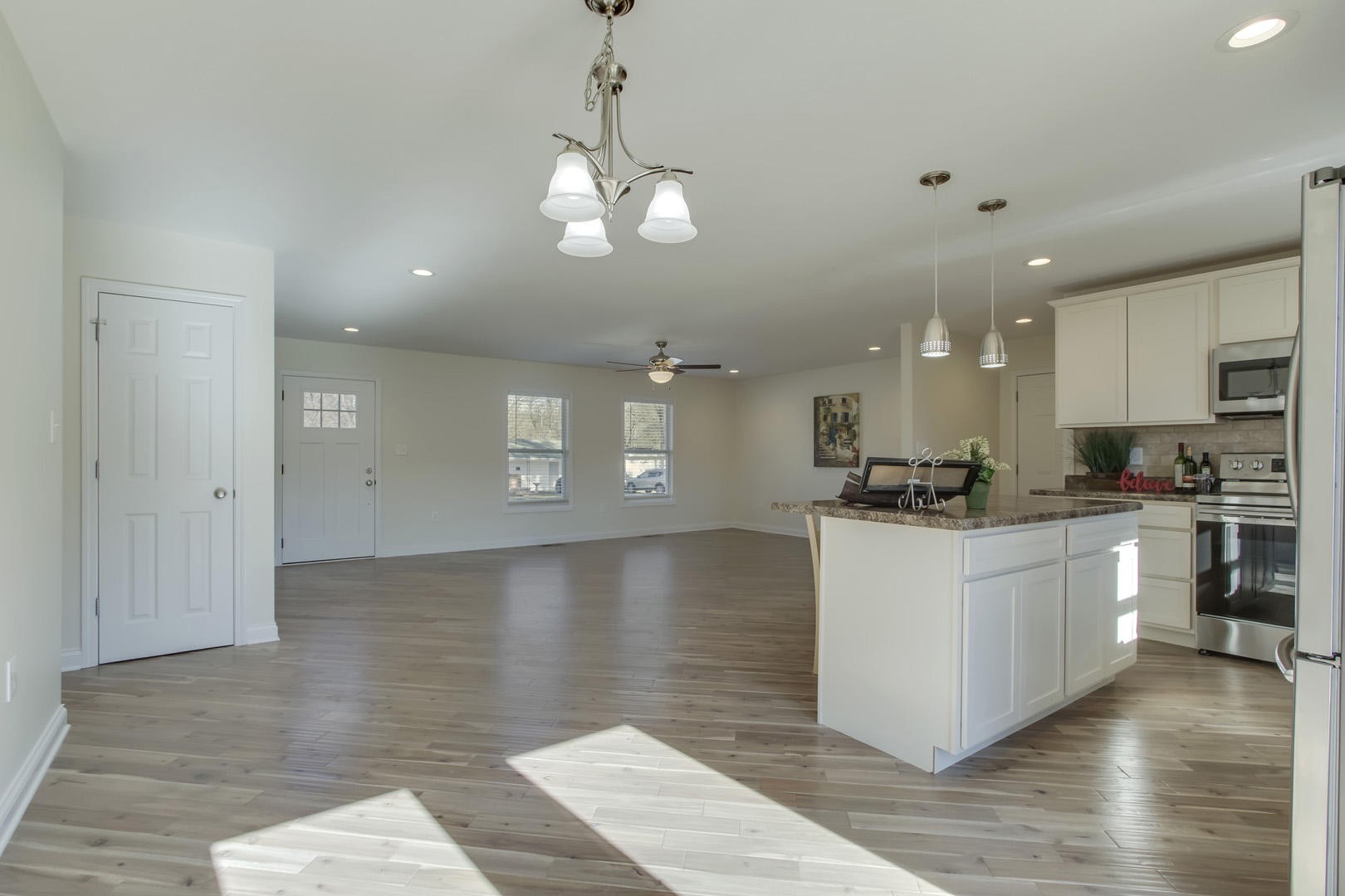 223 Butler Road Oak Ridge, TN 37830 - Photo 14 of 27 a kitchen with stainless steel appliances kitchen island granite countertop a stove a sink and a refrigerator