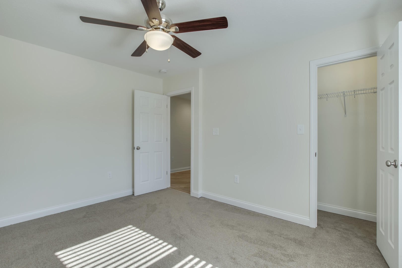 223 Butler Road Oak Ridge, TN 37830 - Photo 20 of 27 an empty room with closet and a chandelier fan
