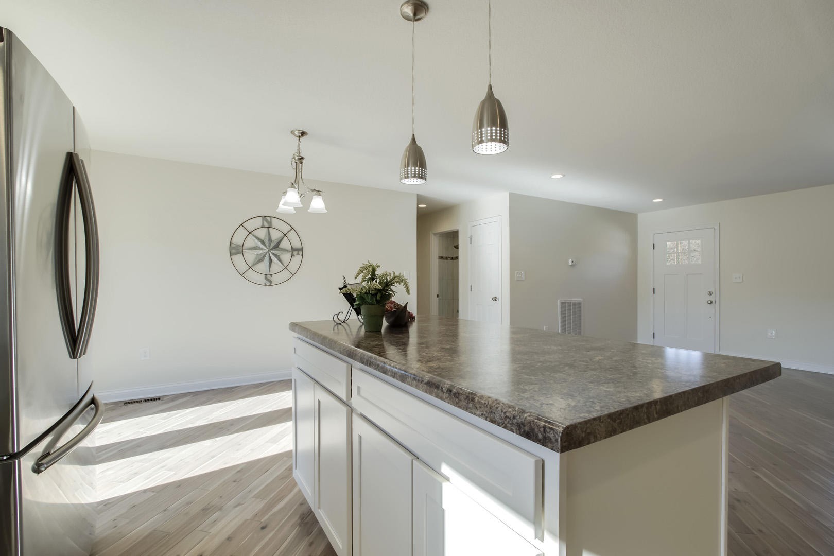 223 Butler Road Oak Ridge, TN 37830 - Photo 7 of 27 a kitchen with stainless steel appliances granite countertop a sink and a refrigerator