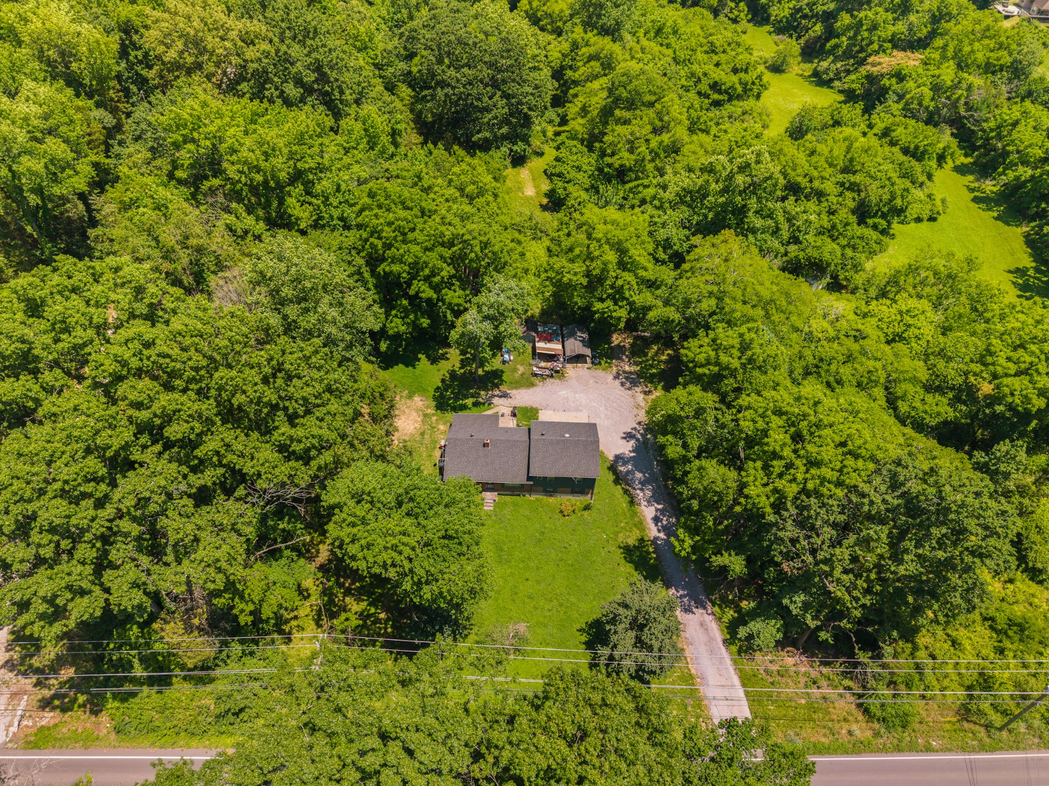 1083 Tulip Grove Road Hermitage, TN 37076 - Photo 6 of 9 a view of a house with a yard
