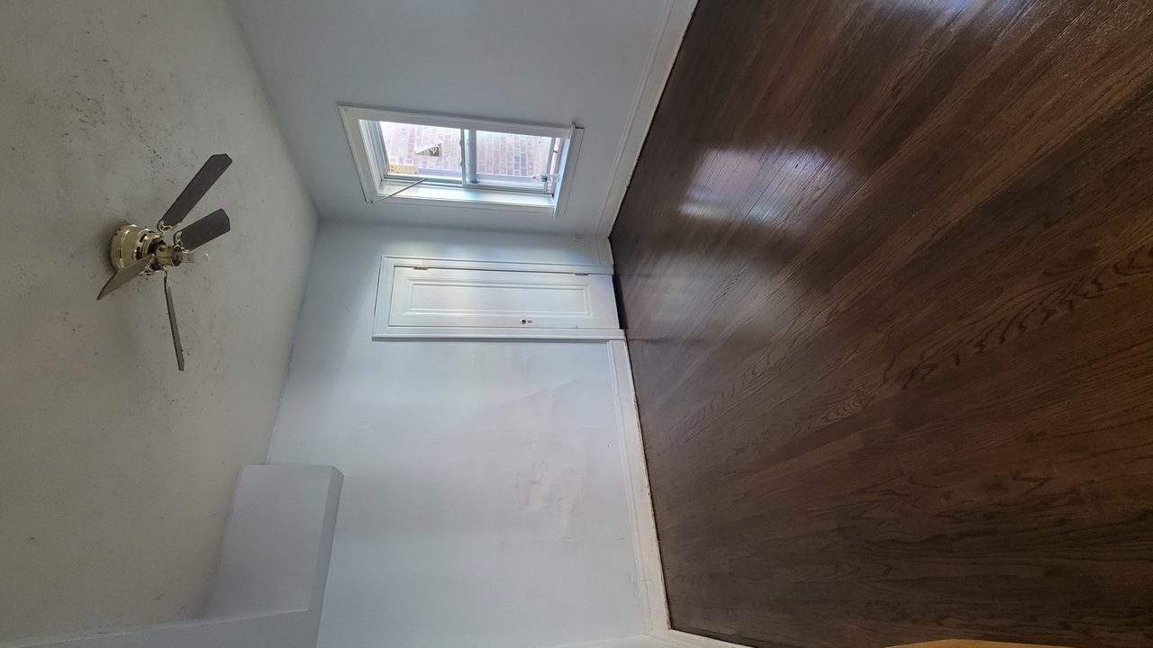 7842 South Bennett Avenue, Unit 2 Chicago, IL 60649 - Photo 6 of 7 a view of empty room with windows