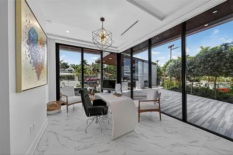 a spacious bedroom with a large bed and a large window