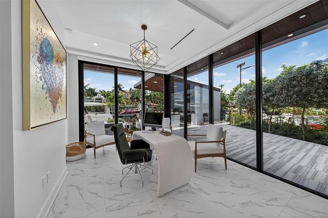 a spacious bedroom with a large bed and a large window
