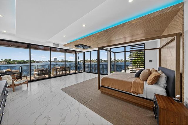 a view of a roof deck with outdoor seating and city view