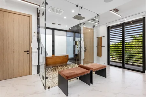 a room with gym equipment and window