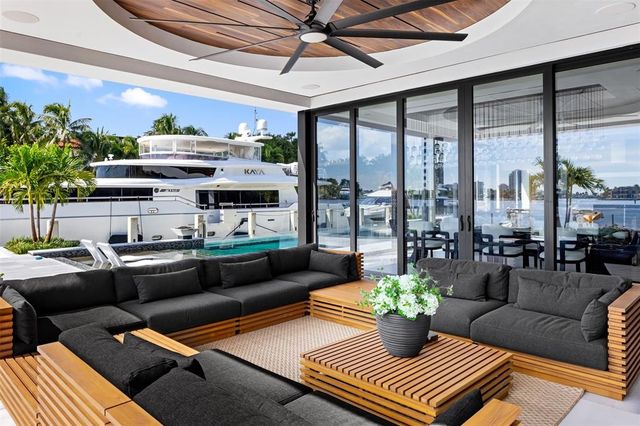 a living room with furniture flowerpot and a potted plant