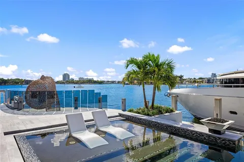 a view of swimming pool with outdoor seating and city view