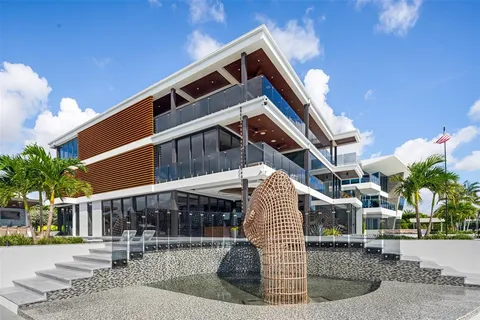 a roof deck with table and chairs