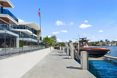 an aerial view of house with yard swimming pool and outdoor seating