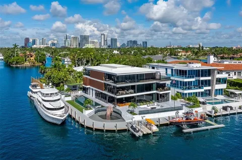 a view of a swimming pool with a couch and wooden floor