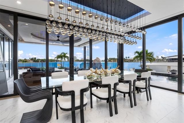 a view of a kitchen with furniture and a porch
