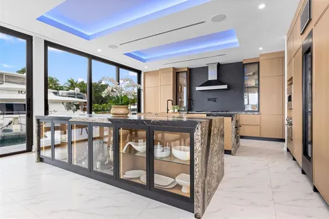 a dining room with furniture and a chandelier