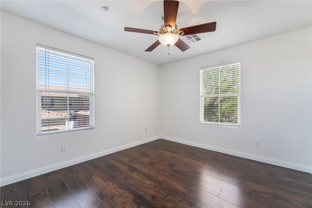 3175 Via Seranova Henderson, NV 89044 - Photo 32 of 45 This bright room features beautiful hardwood flooring and ample natural light from two large windows.