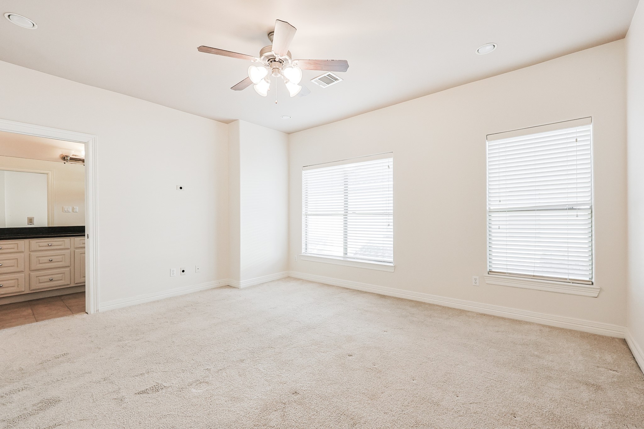 2540 Prospect Street, Unit C Houston, TX 77004 - Photo 17 of 31 an empty room with windows and fan