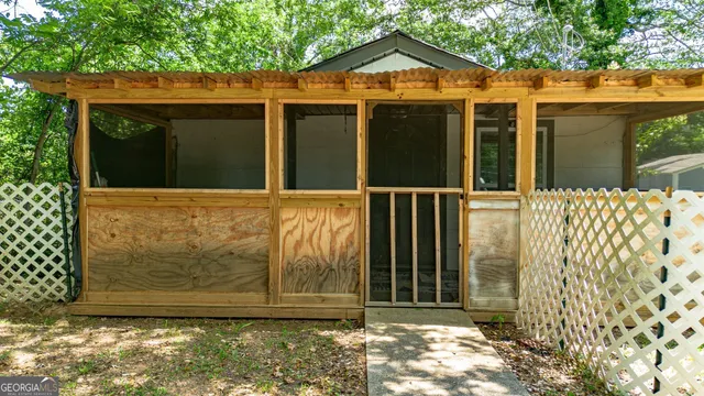 a view of a house with a small yard