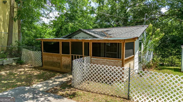 a view of a house with a small yard