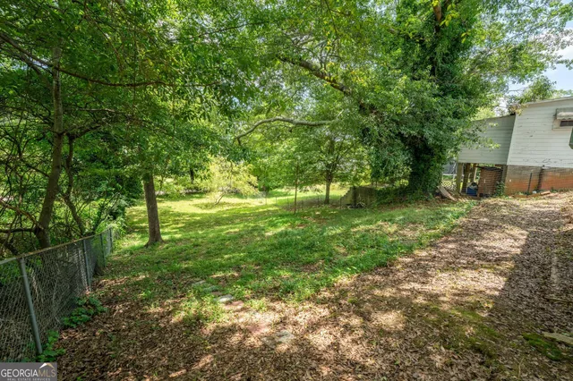 a backyard of a house with lots of green space