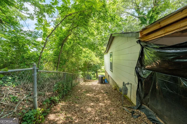 a backyard of a house with lots of green space