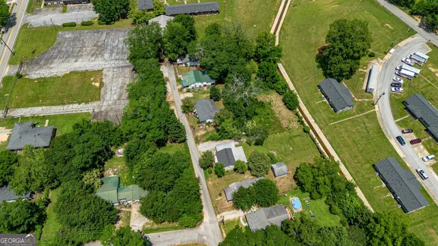 an aerial view of residential houses with outdoor space
