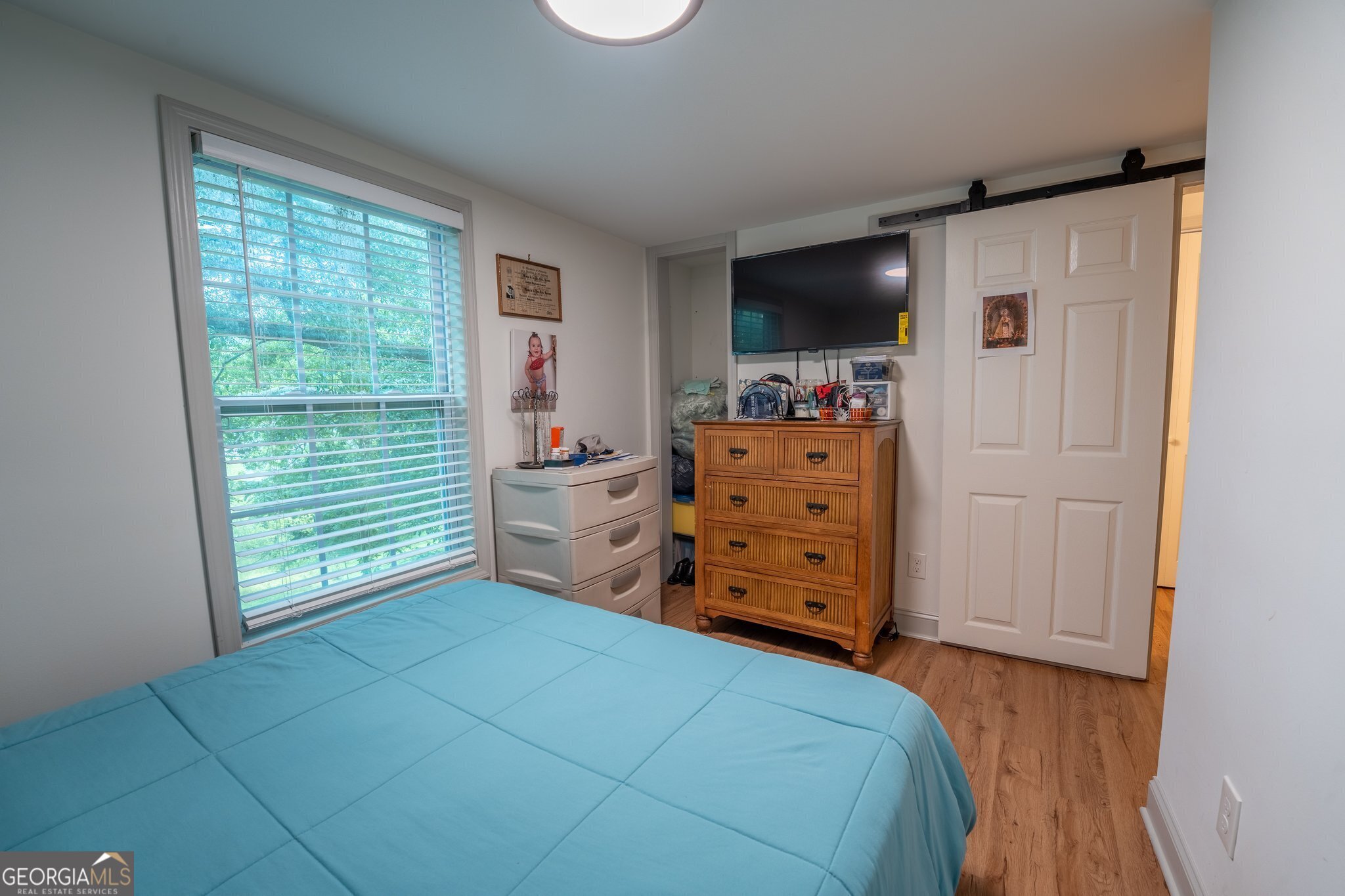 128 Branch Street Toccoa, GA 30577 - Photo 7 of 38 a bedroom with a bed and flat screen tv