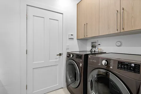 a spacious bathroom with a bathtub and shower
