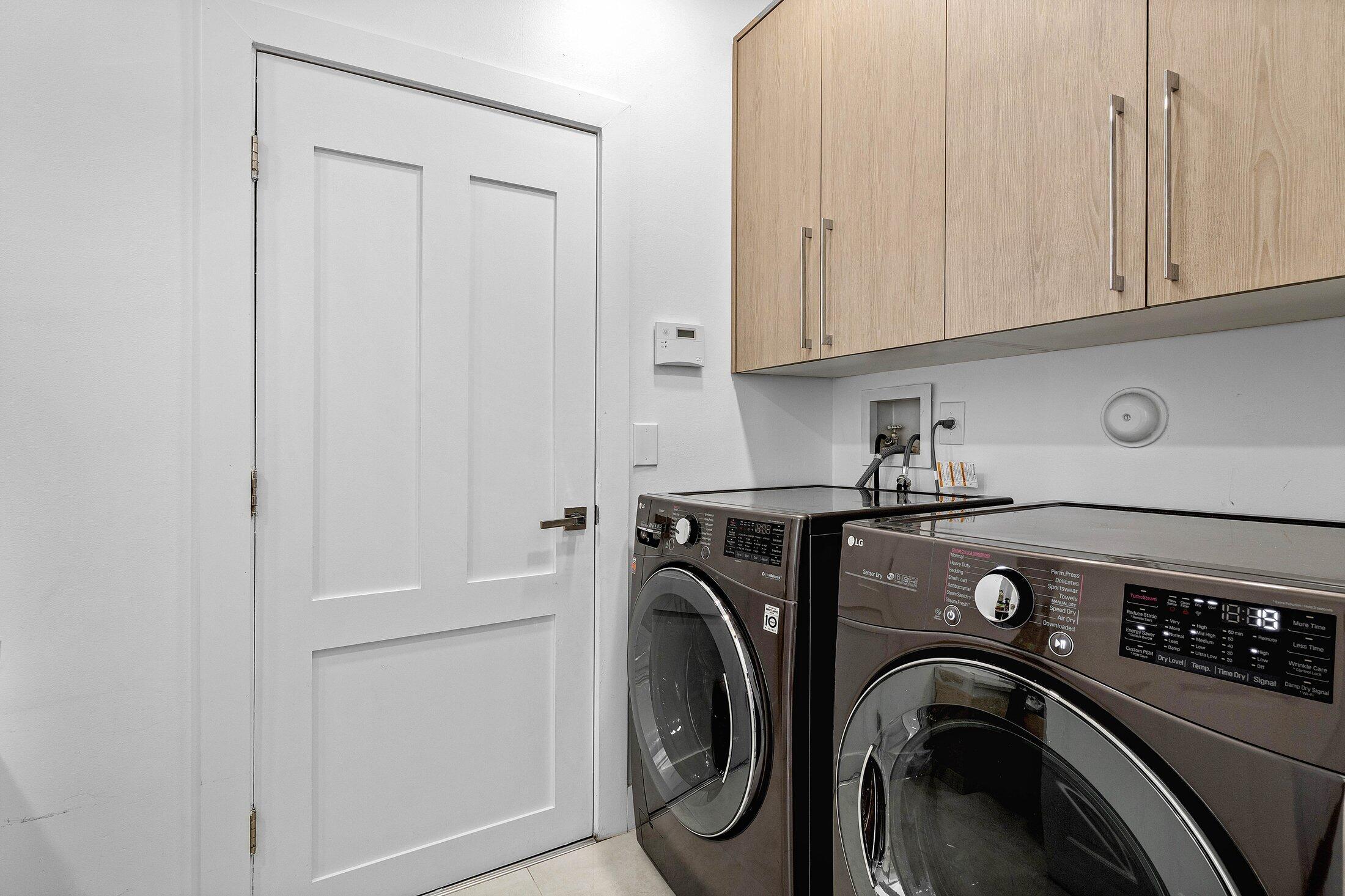 6334 Northwest 24th Street Boca Raton, FL 33434 - Photo 20 of 56 a utility room with dryer and washer